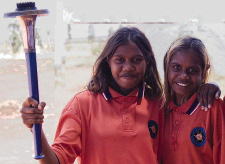 School children at Uluru hold the World Harmony Run torch - 2008