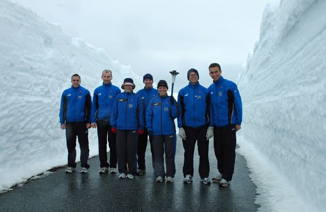 Team by snow walls