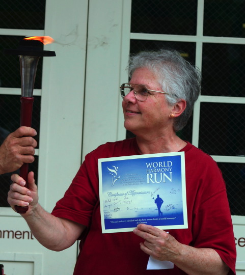 Ingrid Wood receiving the certificate